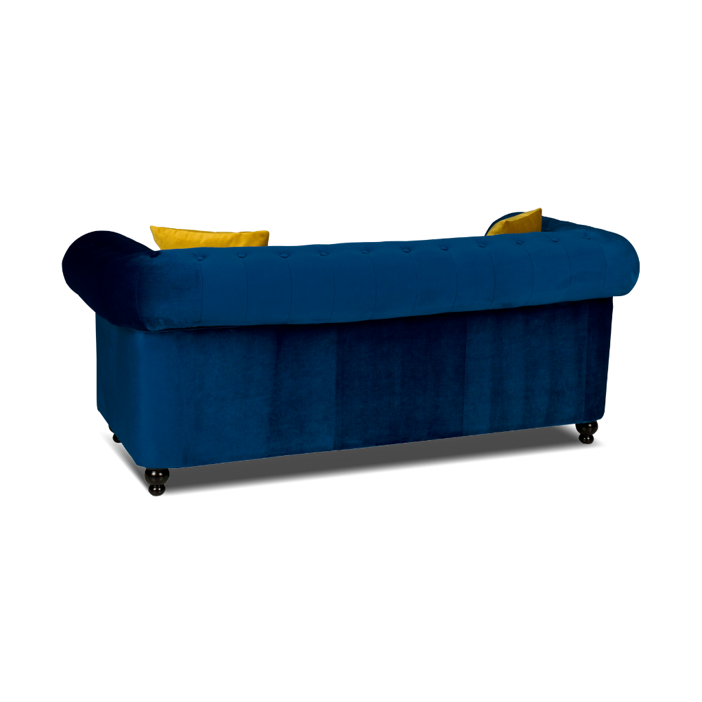 chesterfield 2 seater sofa plush velvet blue with 2 yellow pillow on the side www.furniturestop.co.uk back view