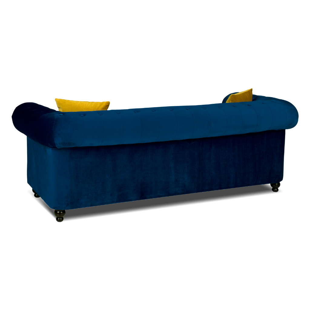 chesterfield 3 seater sofa plush velvet blue with 2 yellow pillow on the side www.furniturestop.co.uk back view